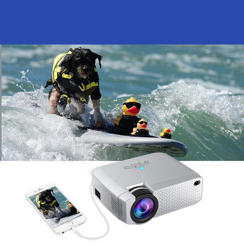 My Store high definition projector, silver portable with blue LED, connected to smartphone on Tampa Home & Garden Store