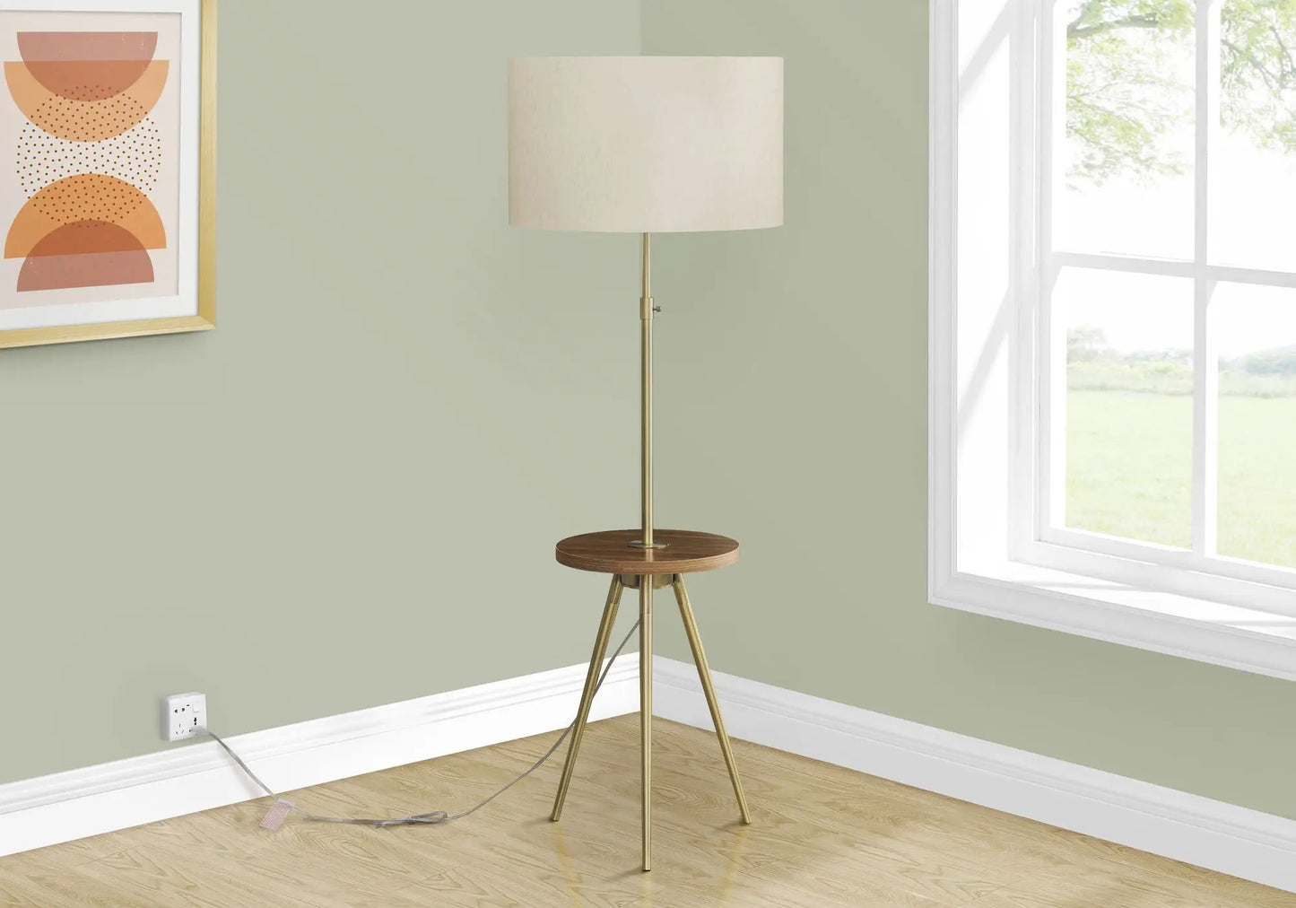 Floor lamp by Unique Piece Furniture with brass tripod and beige drum shade in a sage green room on Tampa Home & Garden Store