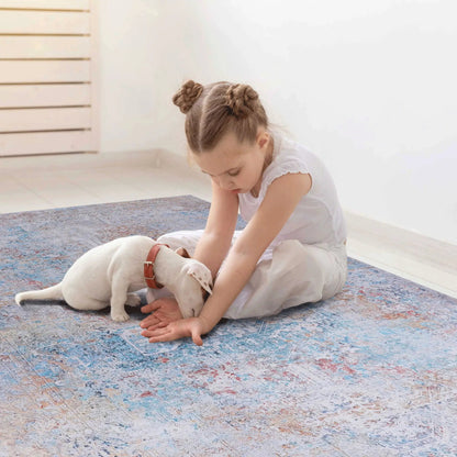 Maval Area Rug Washable in blue abstract pattern by Unique Piece Furniture with a child and dog on rug on Tampa Home & Garden Store