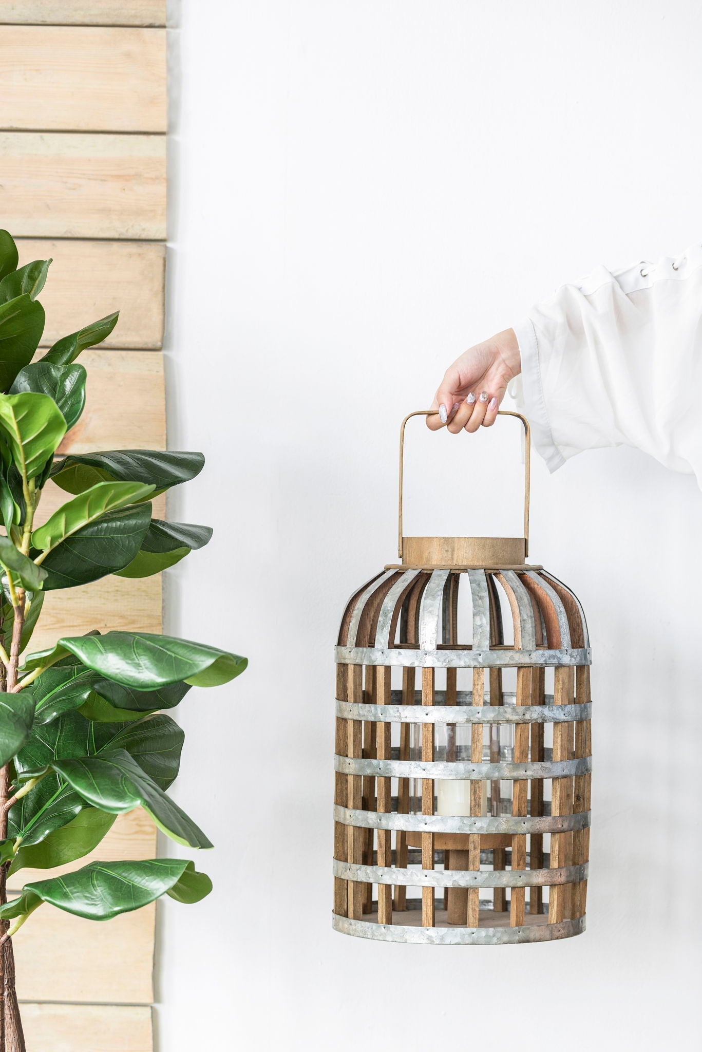 Decorative wooden lantern with a metal frame and carry handle for indoor outdoor use on Tampa Home & Garden Store