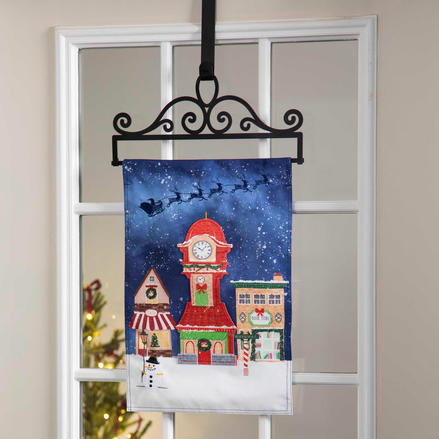 Scroll Garden Flag Over the Door Hanger on black metal scrollwork flag stand on Tampa Home & Garden Store
