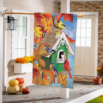 Colorful bird house suede flag with yellow birds among autumn leaves against blue sky on Tampa Home & Garden Store