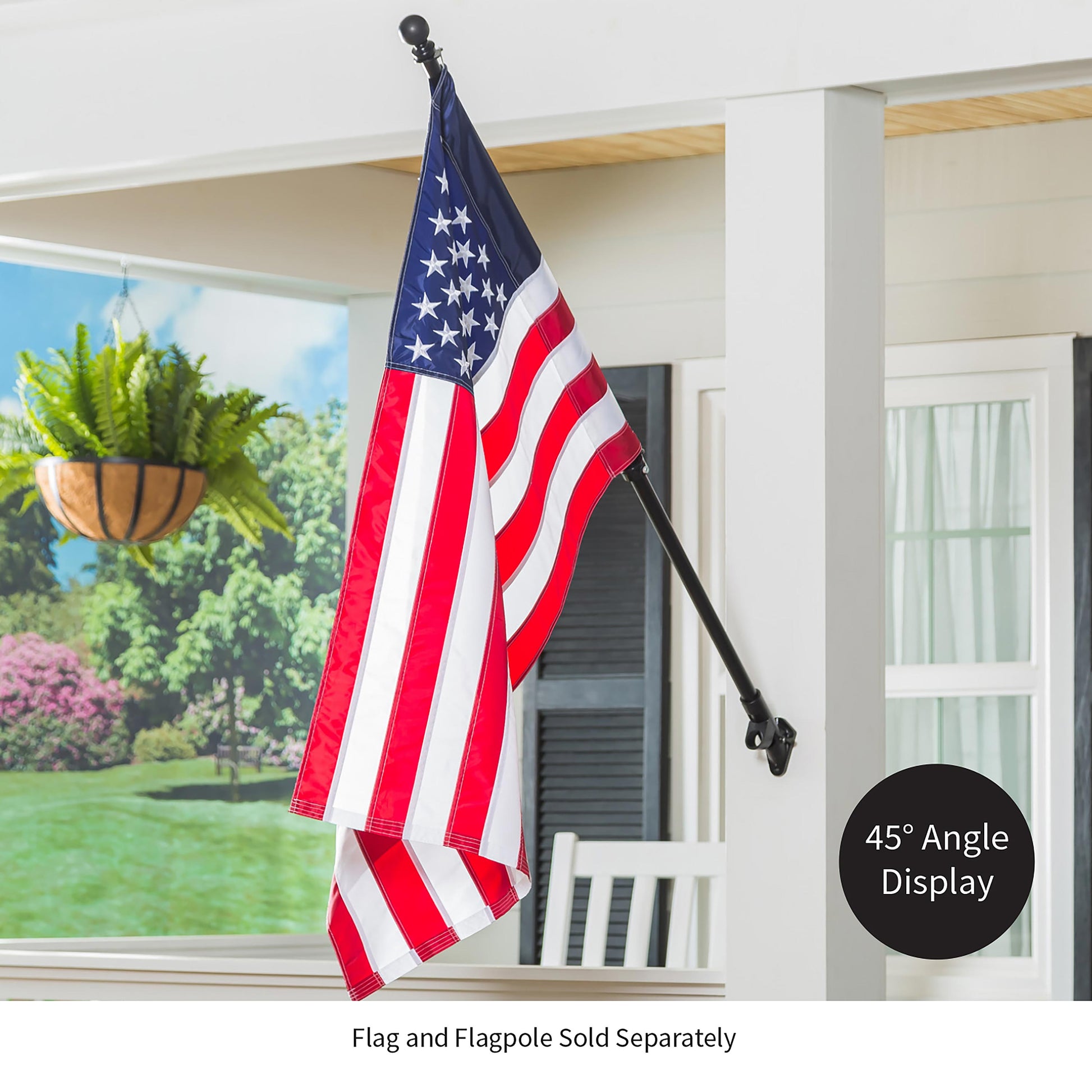 2-Position Cast Iron House Flag Bracket Black mounted on a white porch post with an American flag on a long black flag pole on Tampa Home & Garden Store