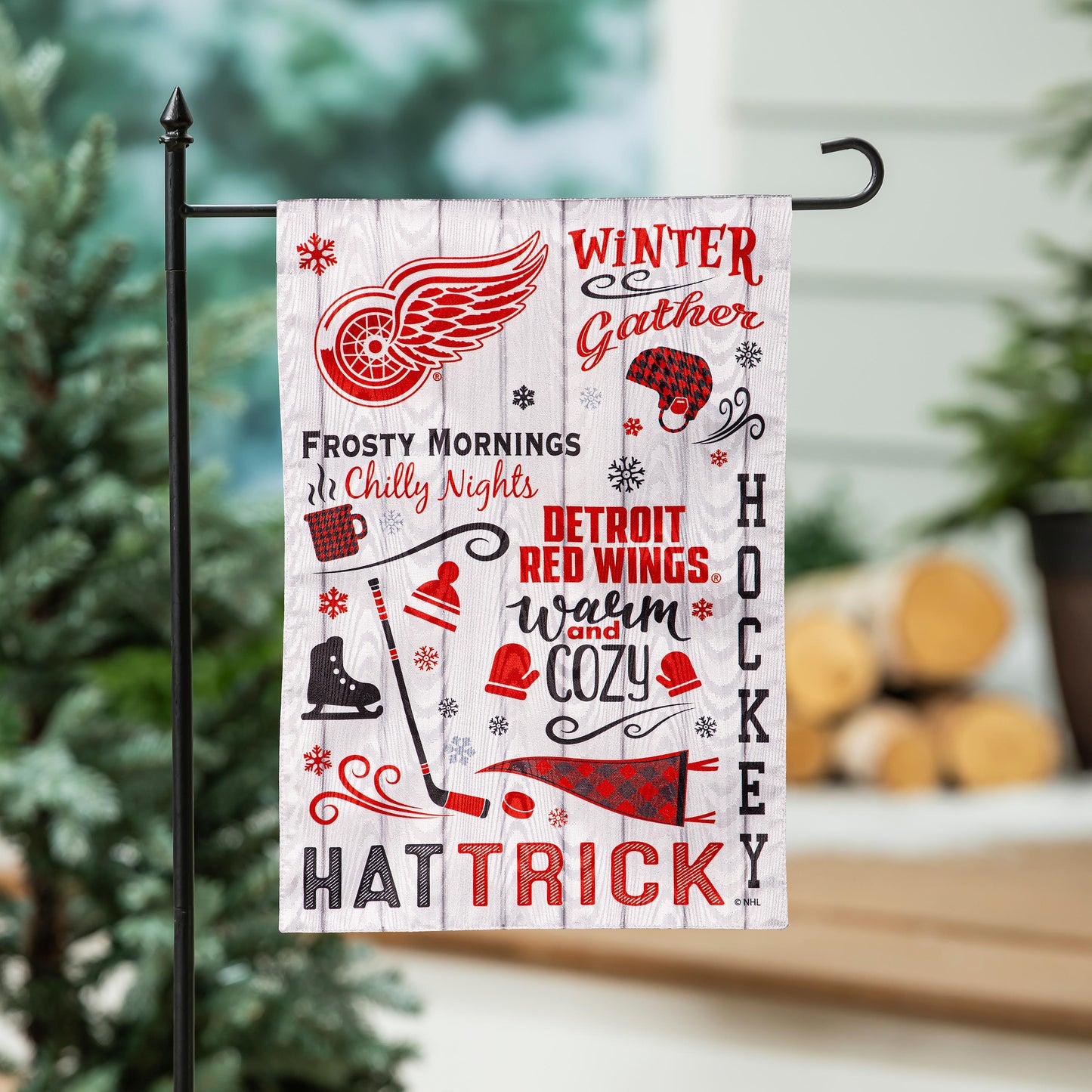 Detroit Red Wings moire flag with winged wheel logo and winter graphics on woodgrain backdrop on Tampa Home & Garden Store