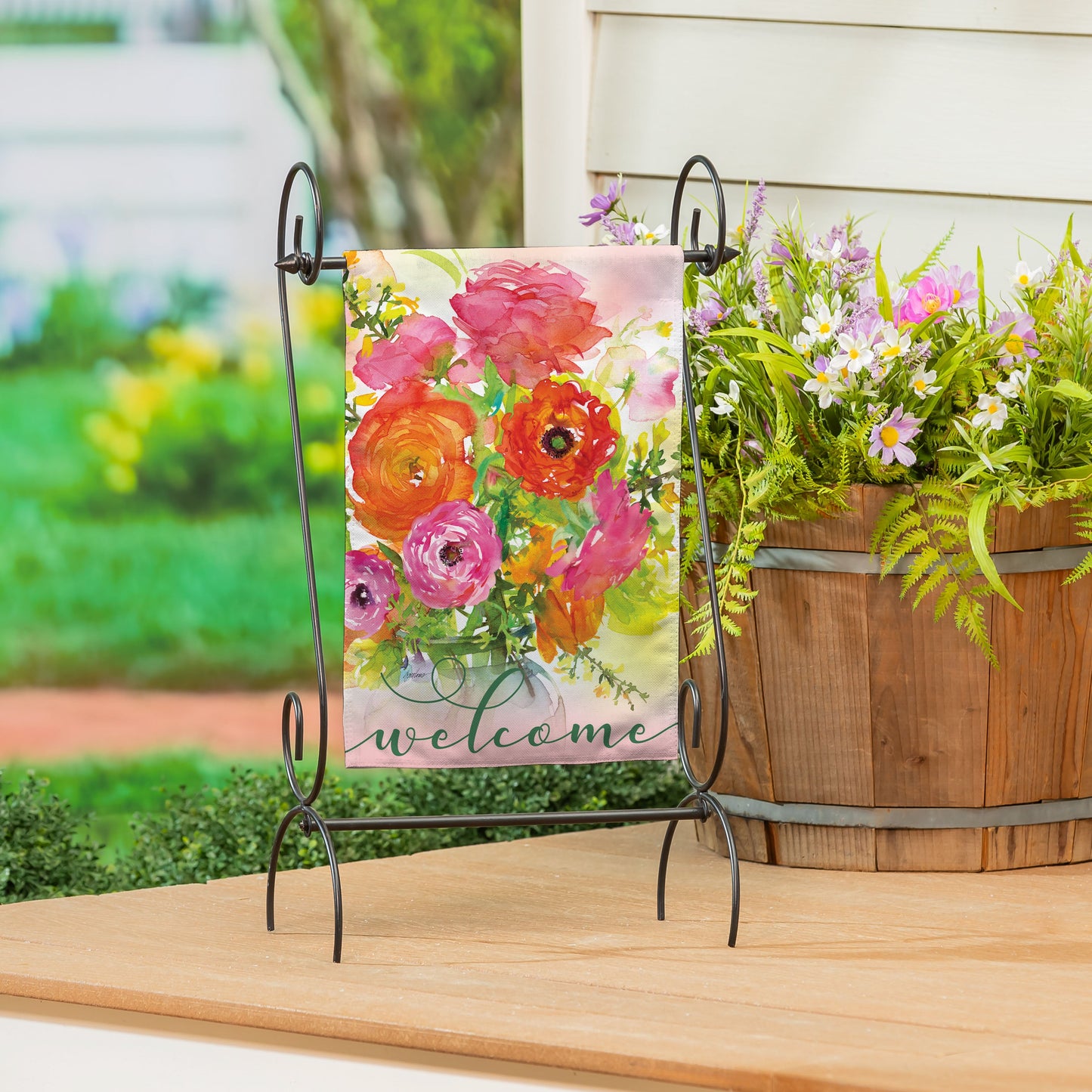 Ronunculus Welcome Burlap Garden Flag by Evergreen Enterprises pink blooms on metal stand on Tampa Home & Garden Store