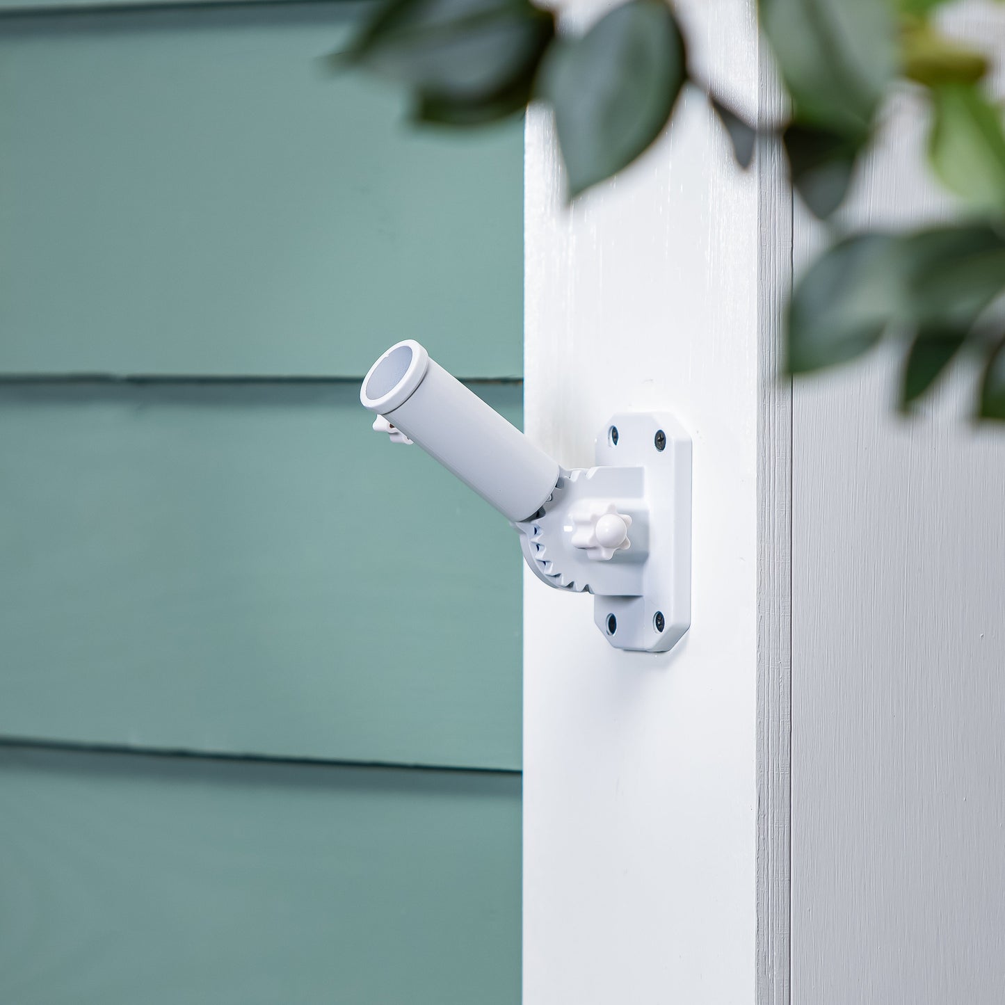 White metal flag bracket with clamp mount on white post by Evergreen Enterprises on Tampa Home & Garden Store