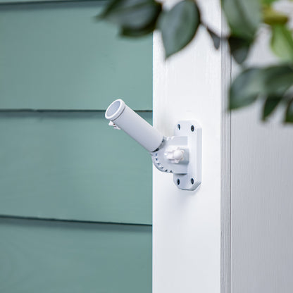 White metal flag bracket with clamp mount on white post by Evergreen Enterprises on Tampa Home & Garden Store
