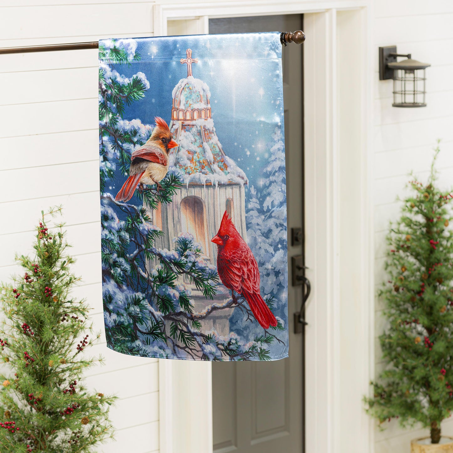 Cardinal Lamp Post Lustre House Flag features a cardinal amid a snowy church dome scene on Tampa Home & Garden Store