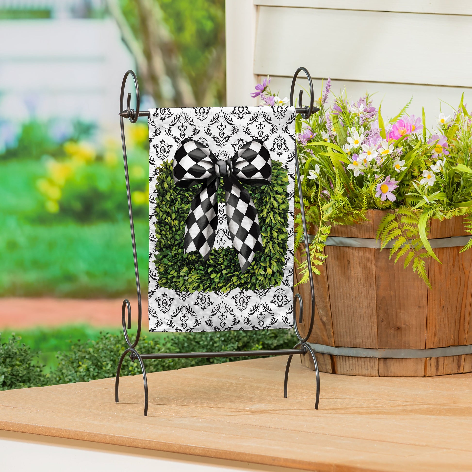 Black & White Burlap Garden Flag with damask design and bold checkered bow on a metal stand on Tampa Home & Garden Store