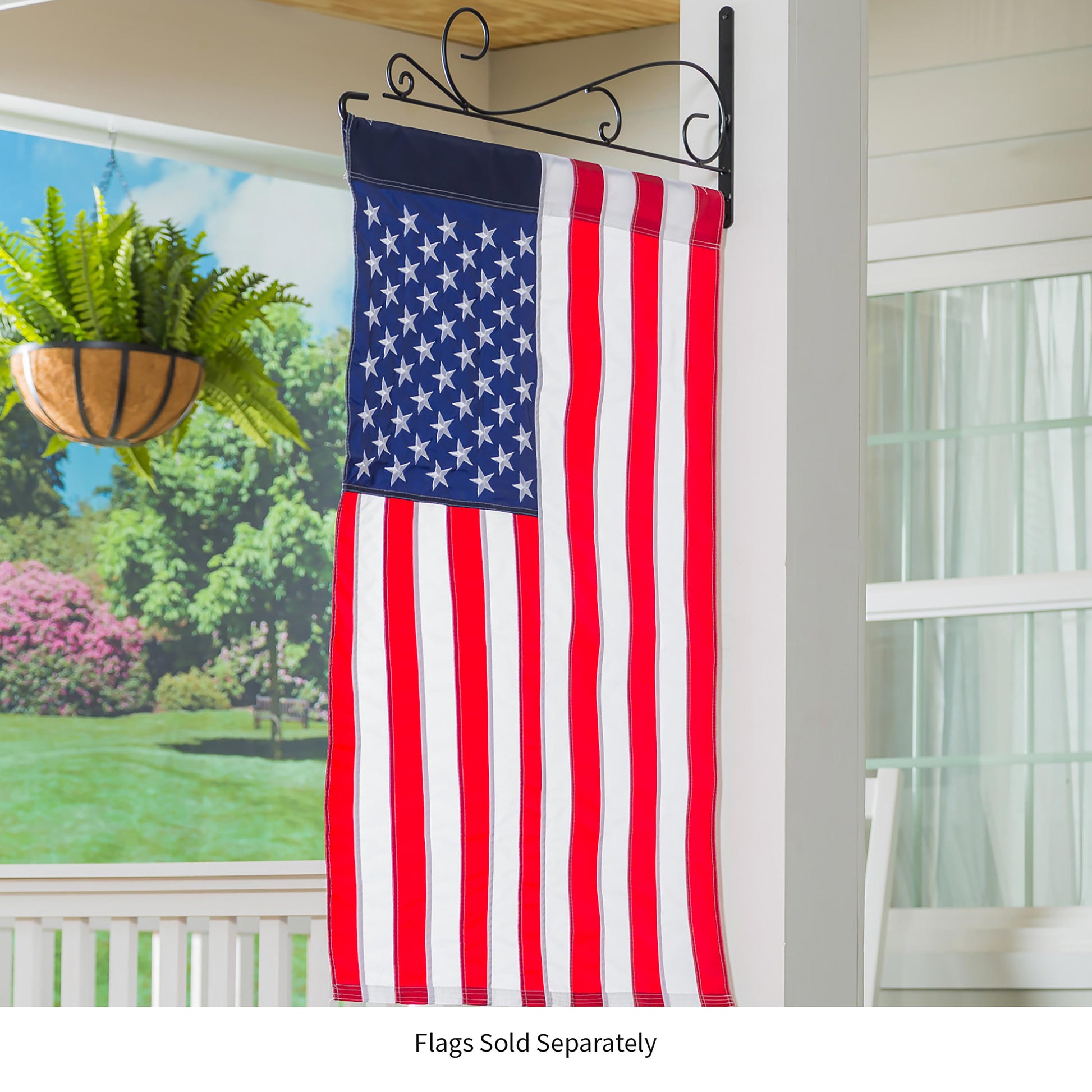Swirl Wall-Mount House Flag Hanger in black metal holding an American flag on Tampa Home & Garden Store