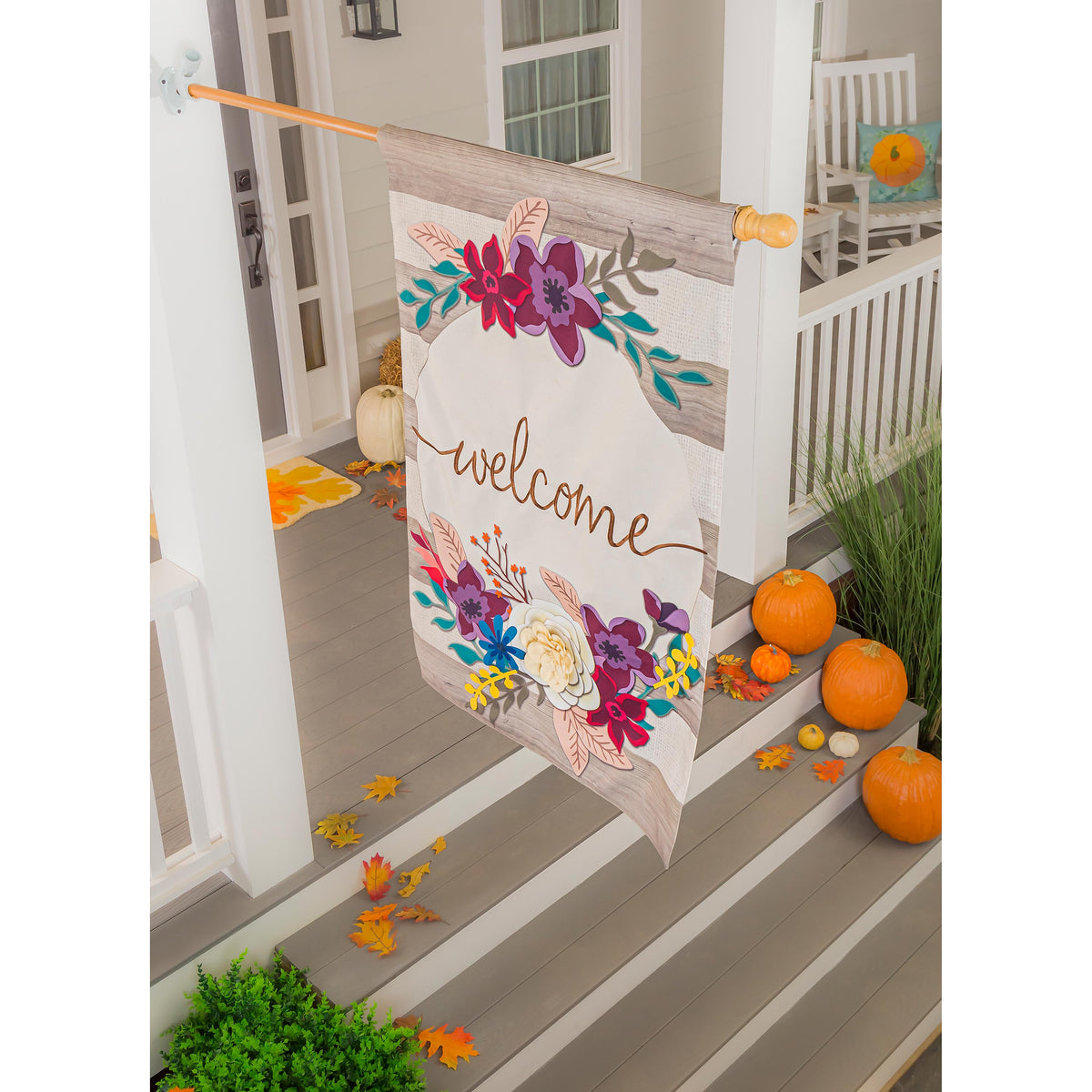 Fall Stripes Welcome House Linen Flag on porch railing with bright floral applique on Tampa Home & Garden Store