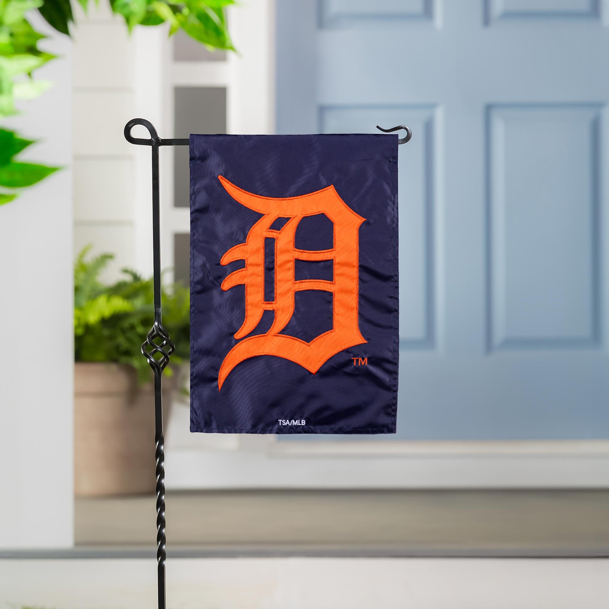 Detroit Tigers applique garden flag navy fabric with orange Tigers logo on black metal garden stand on Tampa Home & Garden Store
