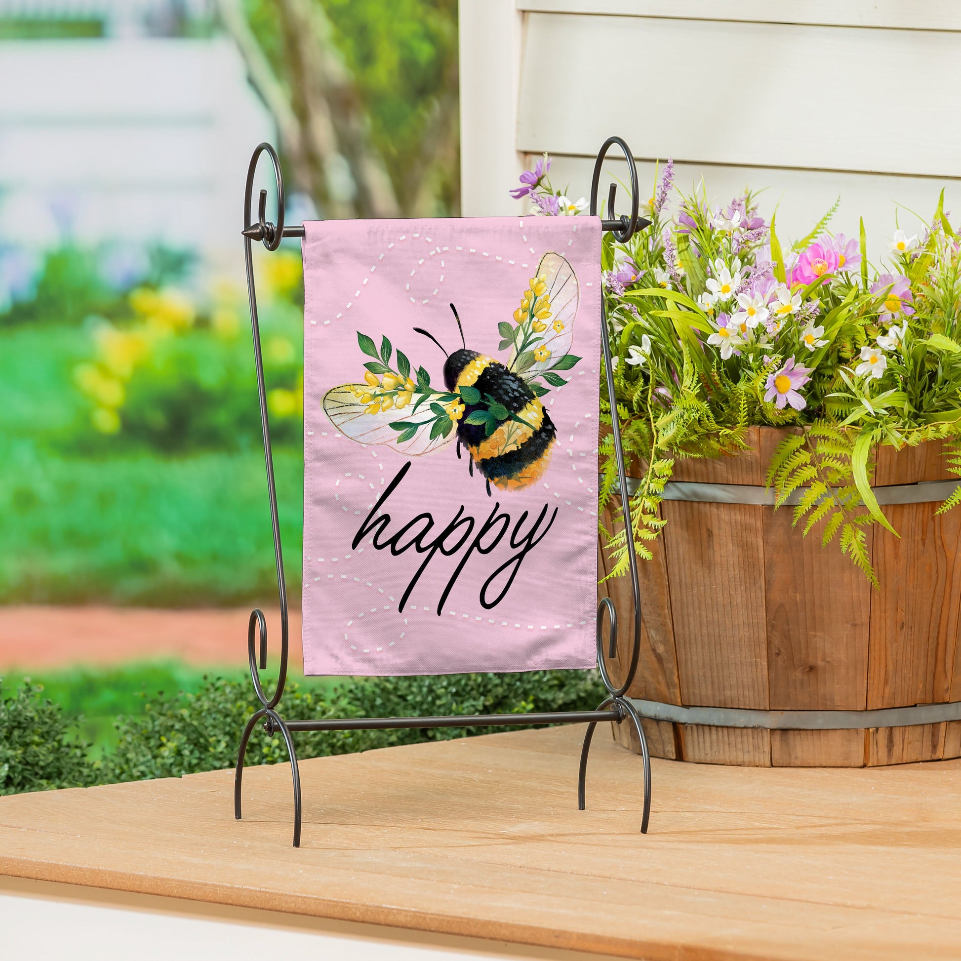 Bee Happy Pink Burlap Garden Flag on a metal stand on Tampa Home & Garden Store