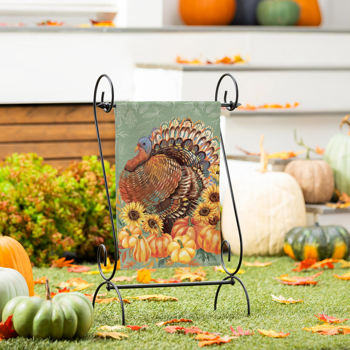 Grateful Gatherings Turkey Suede Garden Flag on black metal stand with a turkey and sunflowers on Tampa Home & Garden Store