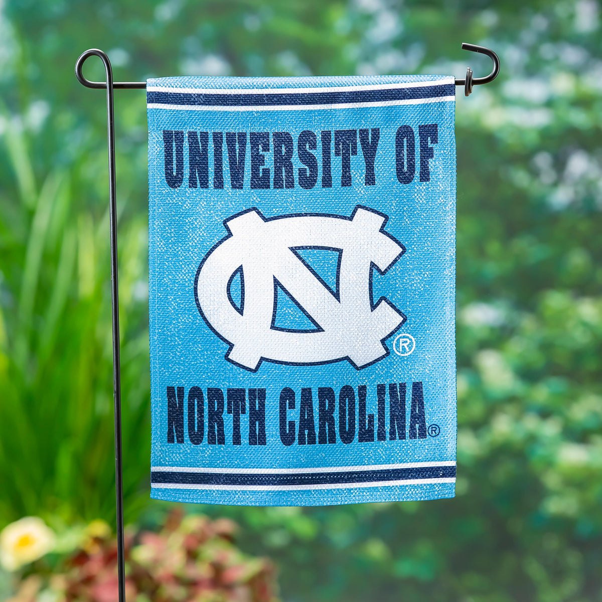 Embossed suede flag UNC, GDN size, blue with white stripe and NC logo on metal garden stake on Tampa Home & Garden Store