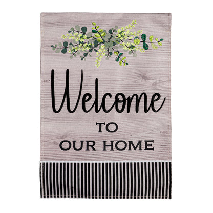 Wood Grain Welcome Burlap Flag with green foliage and Welcome to Our Home script on Tampa Home & Garden Store