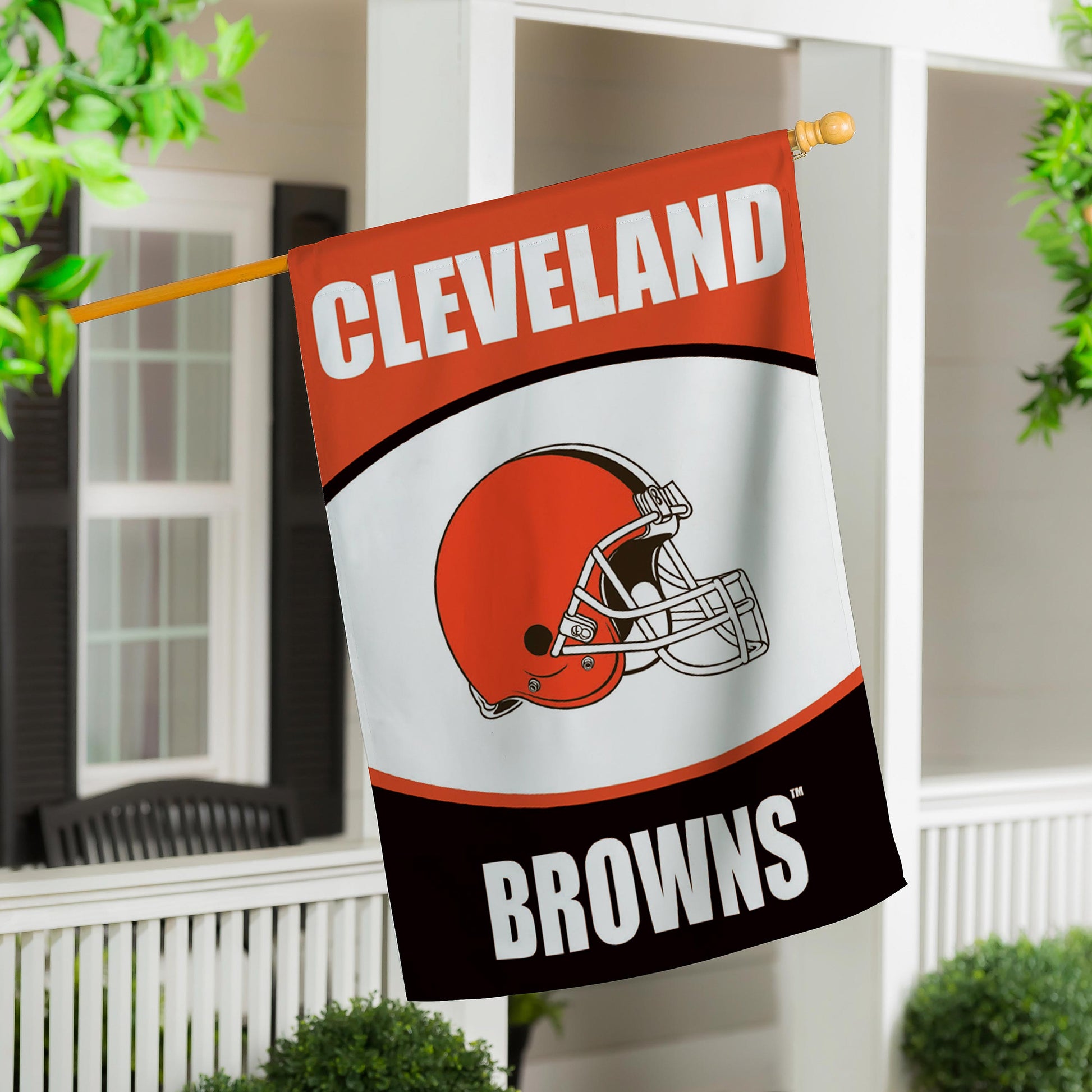 Cleveland Browns suede house flag with orange white helmet graphic hanging on porch on Tampa Home & Garden Store