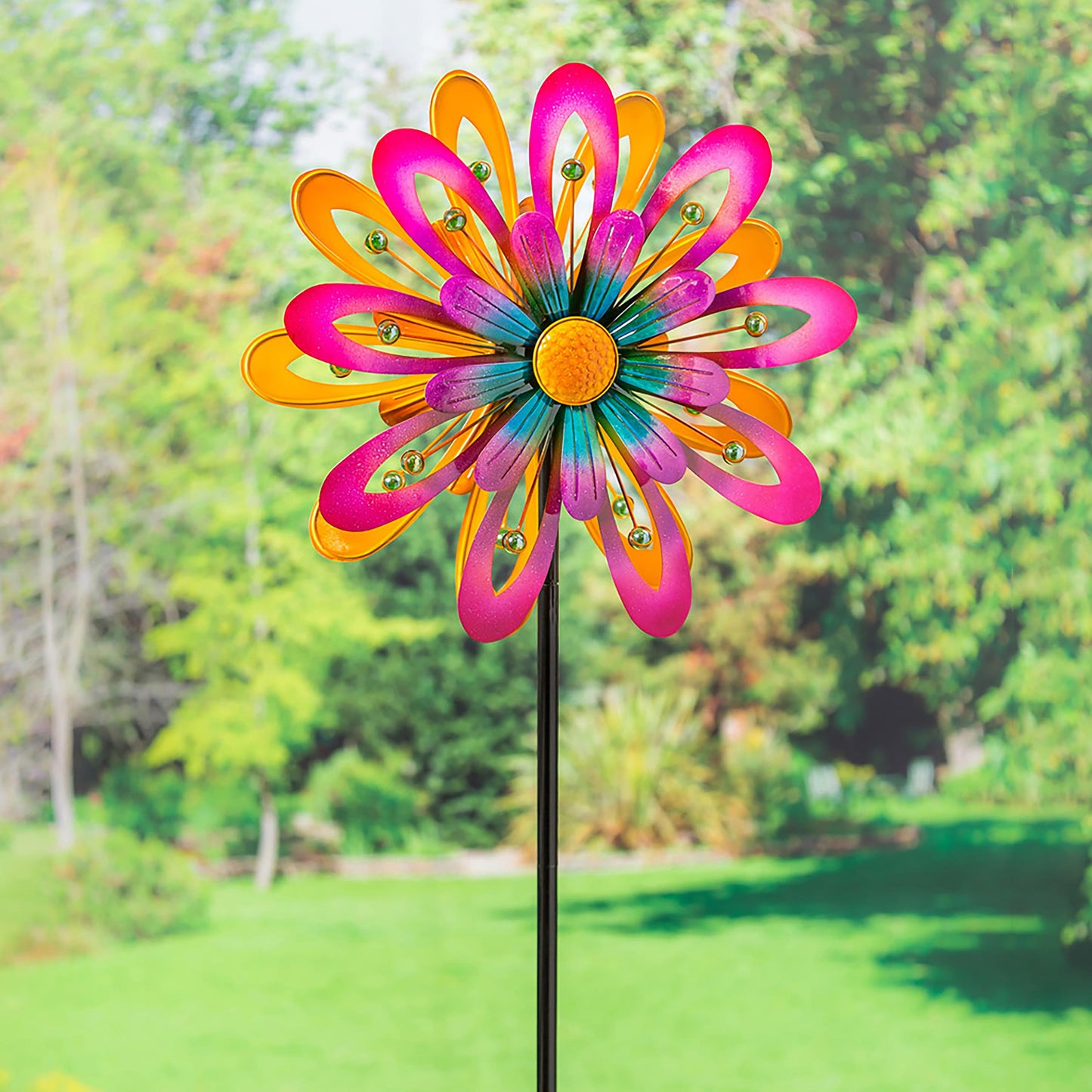 Flower Power Spinner wind spinner with bright pink and orange petals on garden stake on Tampa Home & Garden Store