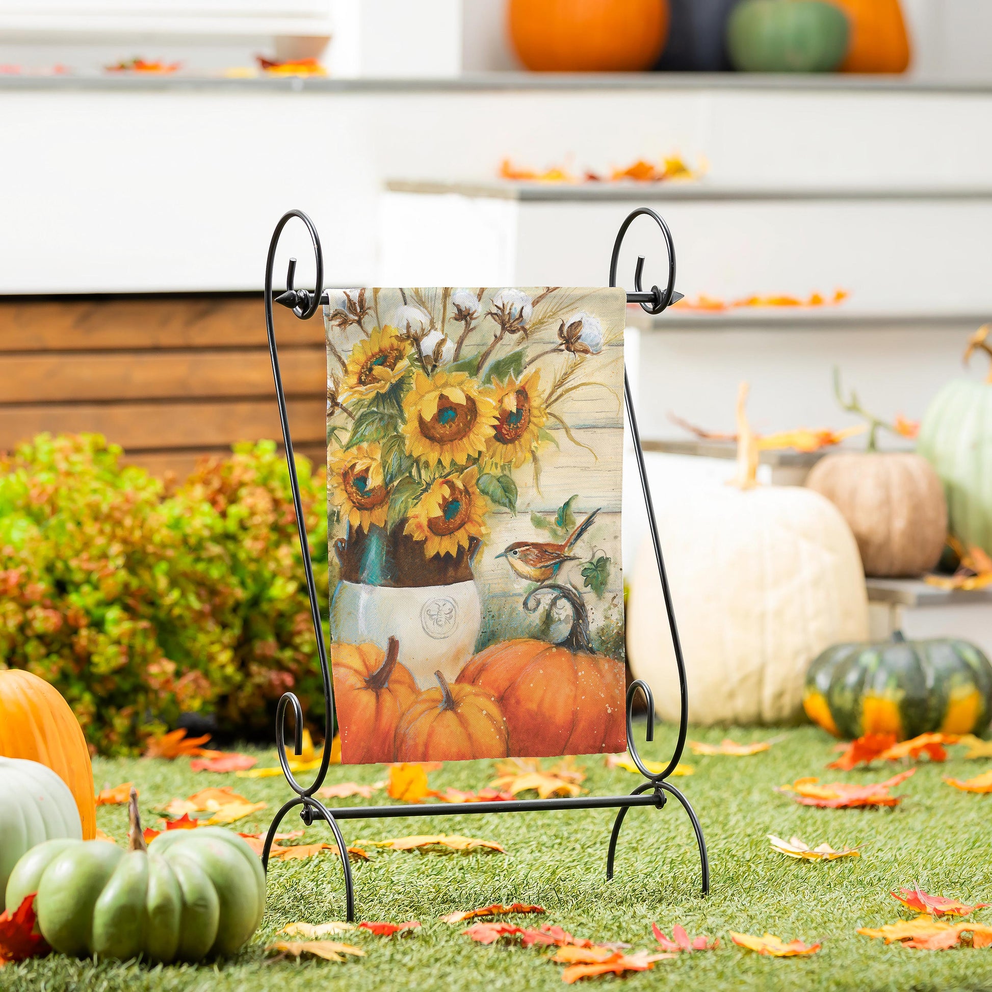 Cotton & Sunflowers Suede Garden Flag on black metal stand with sunflower artwork in autumn hues on Tampa Home & Garden Store