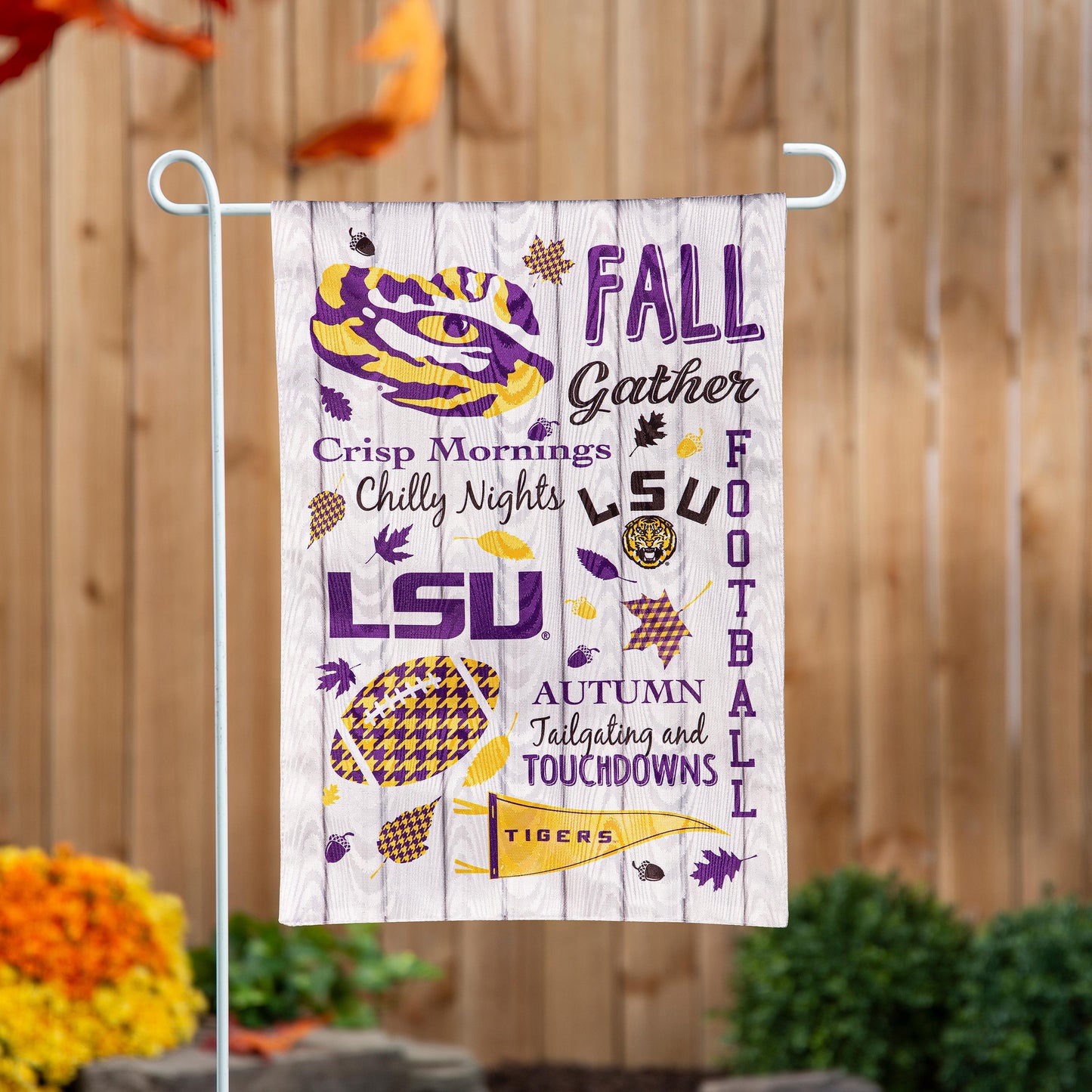 LSU Moire Flag with purple and gold tiger and fall text on wood backdrop on white stand on Tampa Home & Garden Store