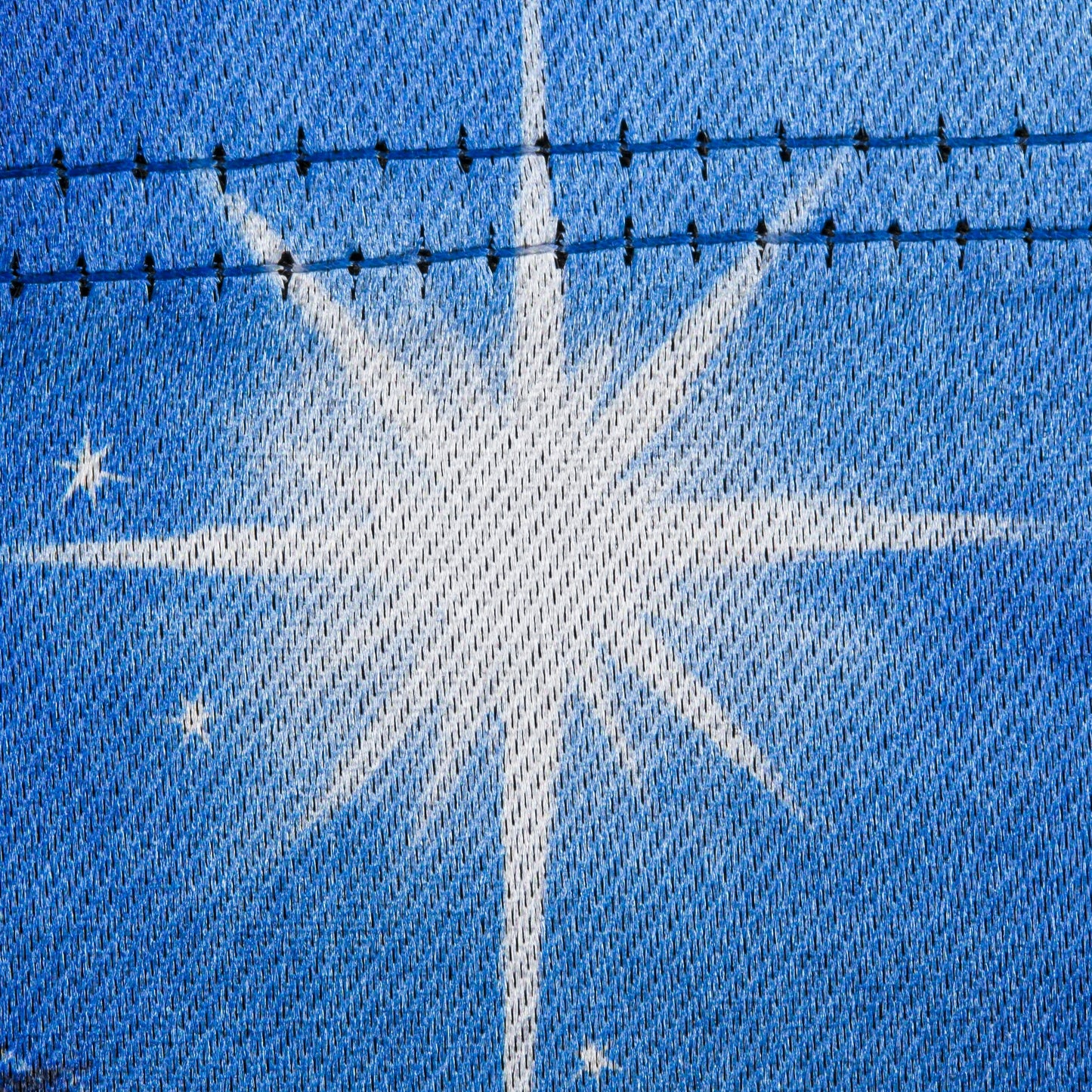 Holy Night Nativity Garden Lustre Flag close-up, blue lustre fabric with white motif on Tampa Home & Garden Store