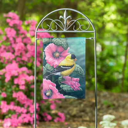 Goldfinch on Hollyhocks suede garden flag with backdrop and pink blooms on a metal stand on Tampa Home & Garden Store
