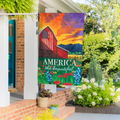America the Beautiful burlap house flag with patriotic barn in orange purple hues on Tampa Home & Garden Store