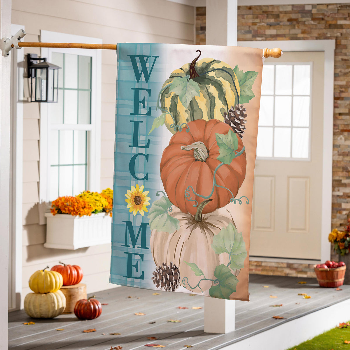 Pumpkin & Pine Suede House Flag with pumpkins and pinecones on teal peach gradient hanging on porch on Tampa Home & Garden Store