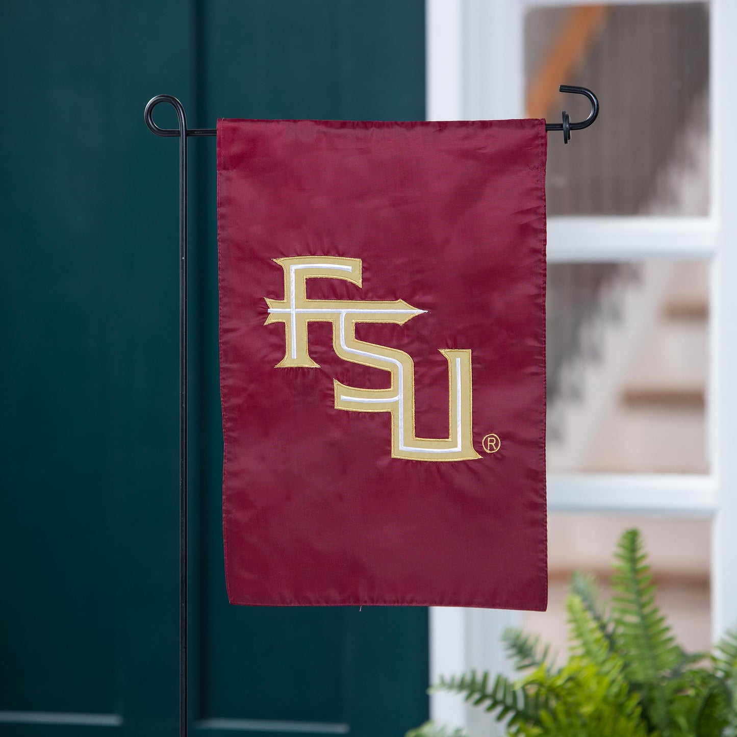 Florida State University applique garden flag garnet with gold FSU lettering on Tampa Home & Garden Store