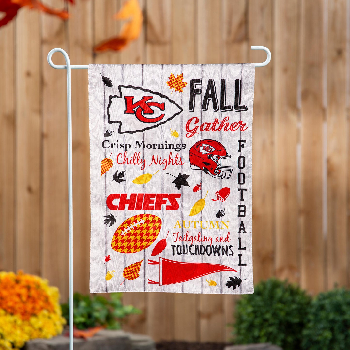 Moire garden flag Kansas City Chiefs with red and gold helmet on gray woodgrain background on Tampa Home & Garden Store