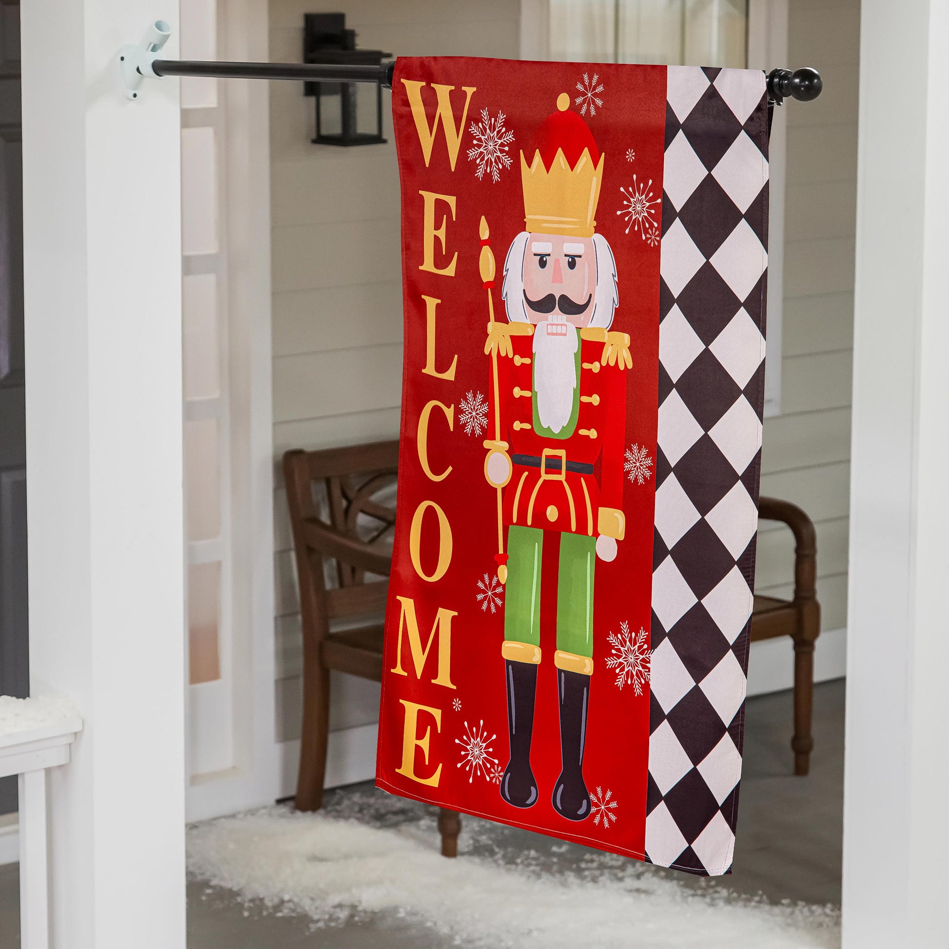 Welcome Nutcracker Suede House Flag red panel with yellow WELCOME letters and nutcracker graphic harlequin border on Tampa Home & Garden Store