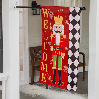 Welcome Nutcracker Suede House Flag red panel with yellow WELCOME letters and nutcracker graphic harlequin border on Tampa Home & Garden Store