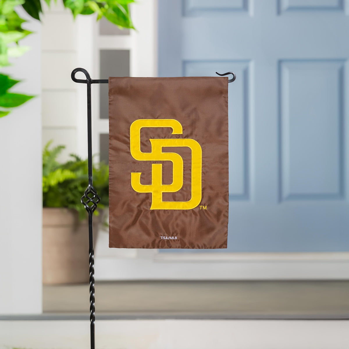 San Diego Padres applique flag on a metal stand; brown fabric with bold yellow SD logo on Tampa Home & Garden Store