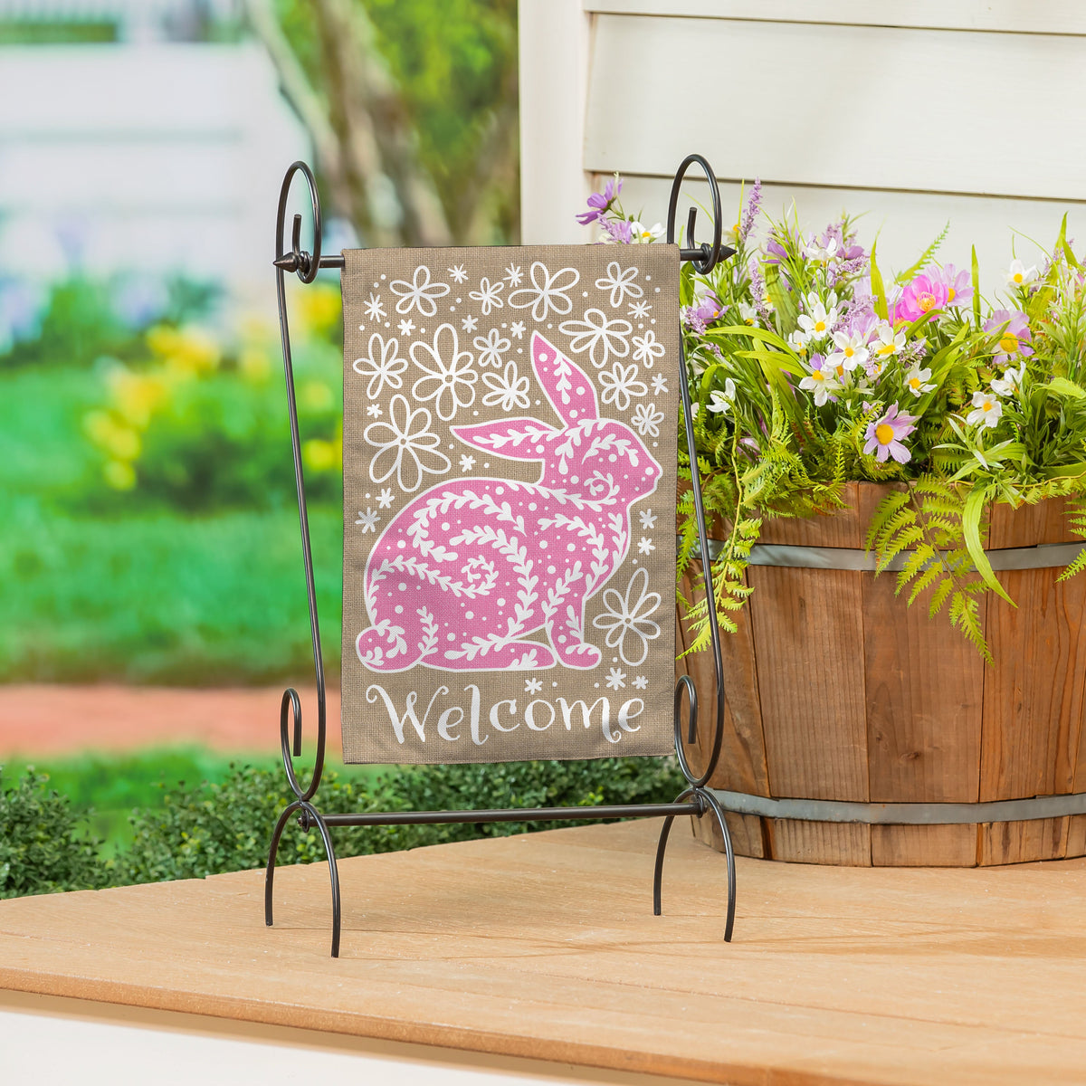 Welcome Leaf Pattern Bunny Burlap Garden Flag on metal stand with pink bunny motif on Tampa Home & Garden Store