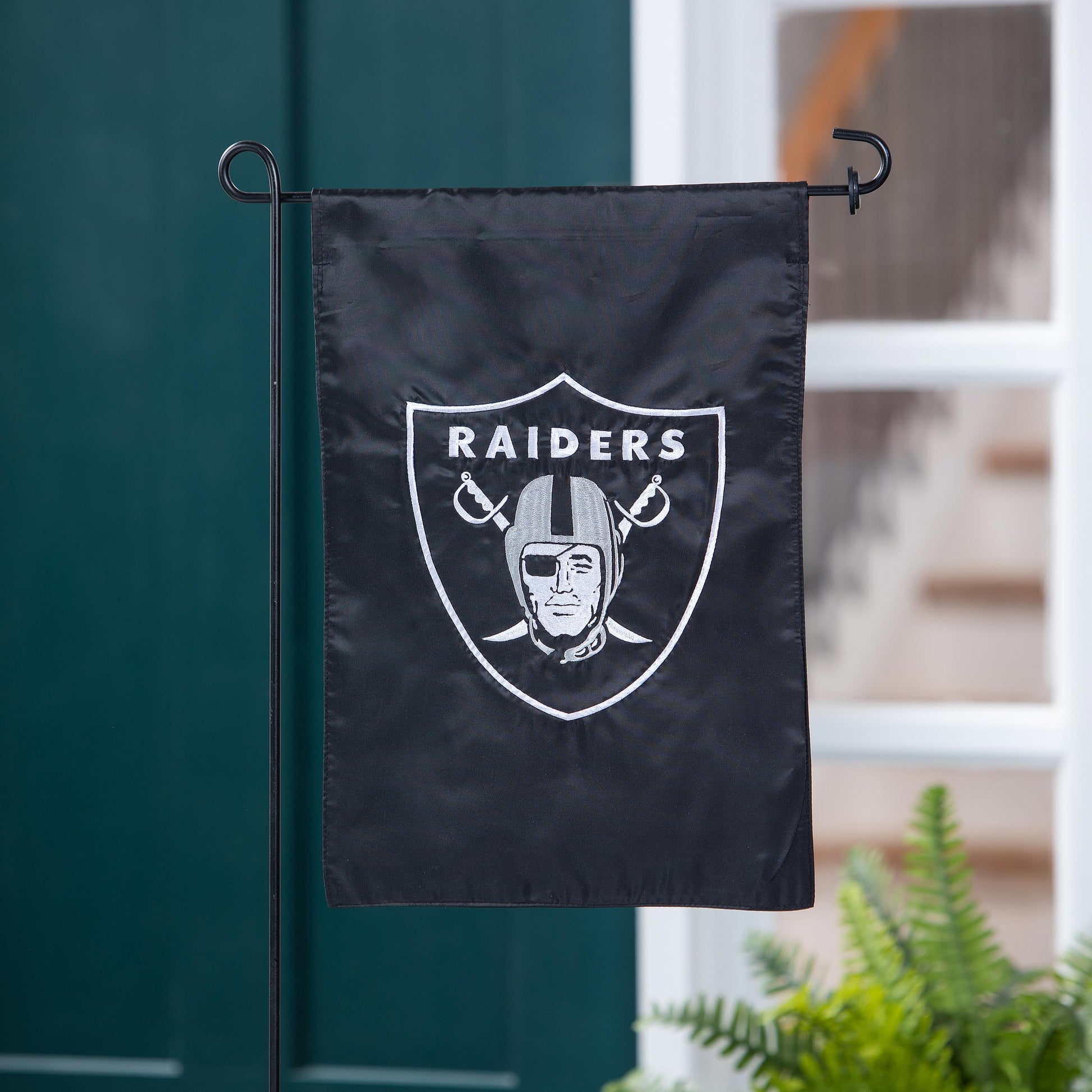 Las Vegas Raiders applique garden flag on black fabric with white Raiders shield logo on Tampa Home & Garden Store