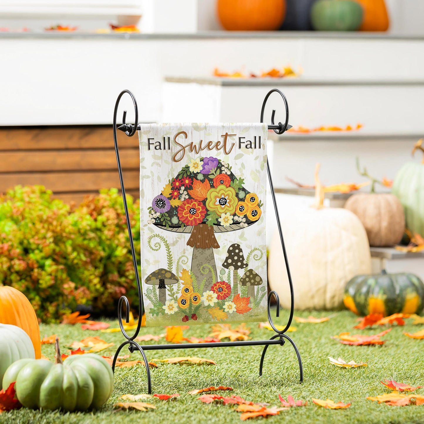 Fall Sweet Fall Burlap Garden Flag with vibrant autumn floral bouquet design on a black metal stand on Tampa Home & Garden Store