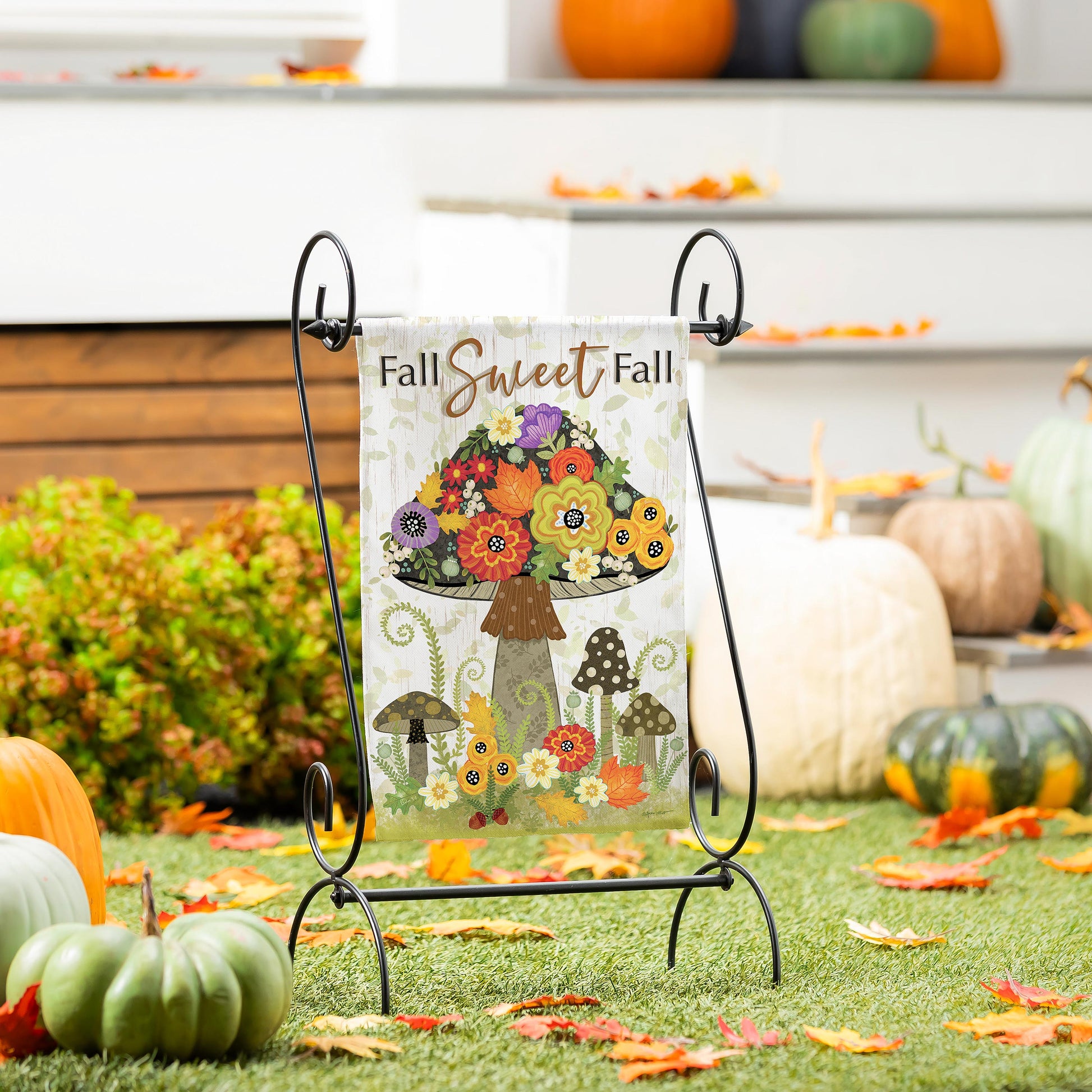 Fall Sweet Fall Burlap Garden Flag with vibrant autumn floral bouquet design on a black metal stand on Tampa Home & Garden Store