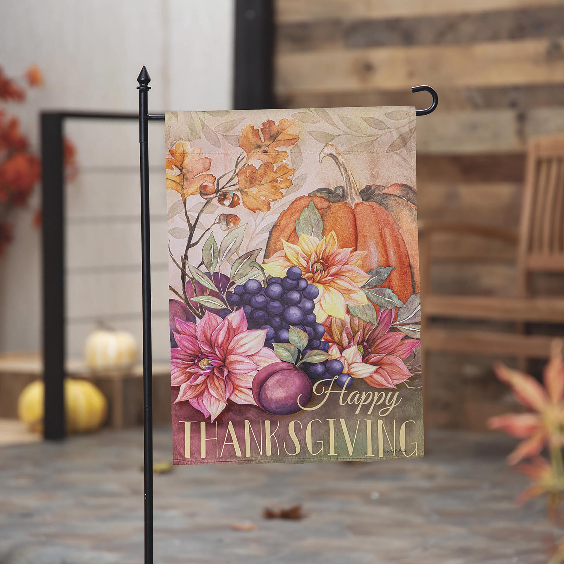 Happy Thanksgiving Suede Garden Flag with autumn leaves, pumpkins, and grapes on a metal stand on Tampa Home & Garden Store
