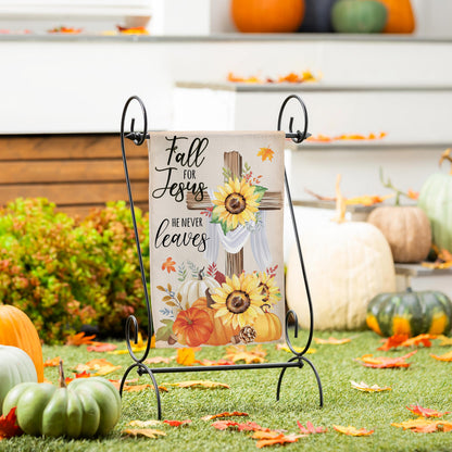 He Will Never Leave suede garden flag on a black metal stand with autumn leaves on Tampa Home & Garden Store