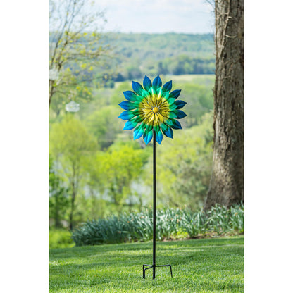 Wind spinner Oceanic 75-inch tall with blue-green petals and yellow center on Tampa Home & Garden Store