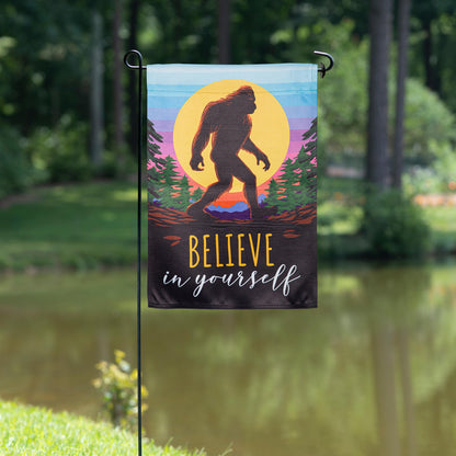 Big Foot Believe In Yourself suede garden flag with silhouetted Bigfoot and sunset stripes on Tampa Home & Garden Store