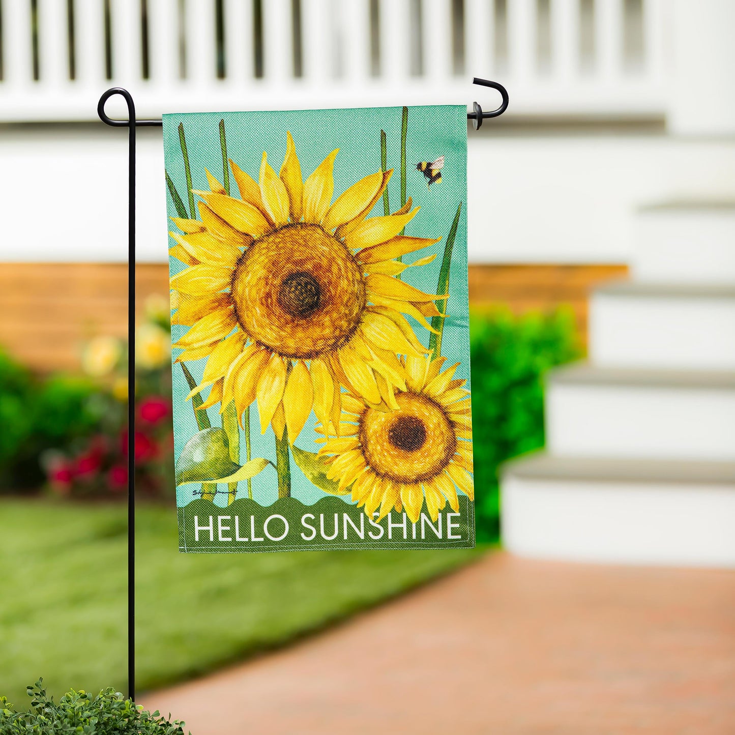 Hello Sunshine Burlap Garden Flag sunflowers on teal burlap mounted on a black metal stake on Tampa Home & Garden Store