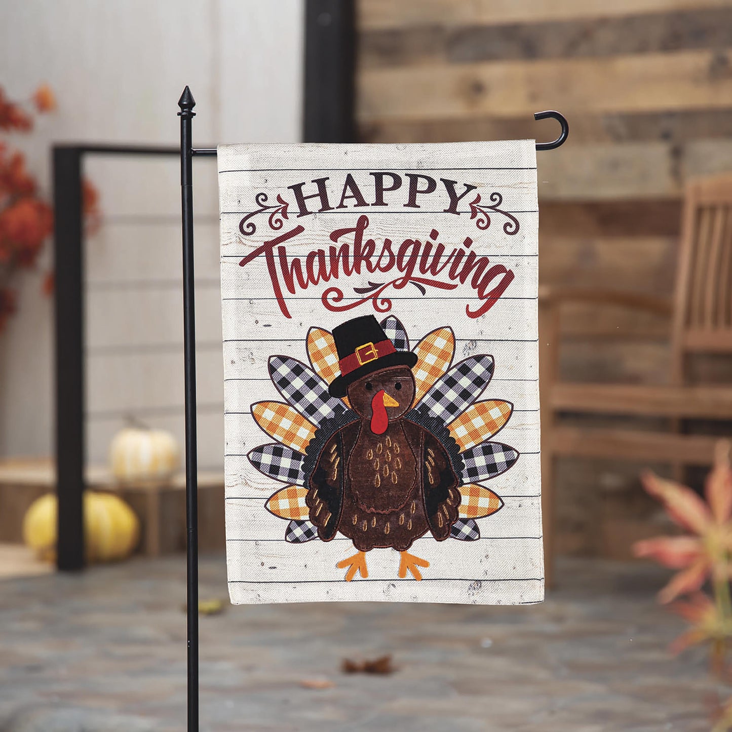 Pilgrim Turkey Burlap Flag with Happy Thanksgiving text on whitewashed wood backdrop on Tampa Home & Garden Store