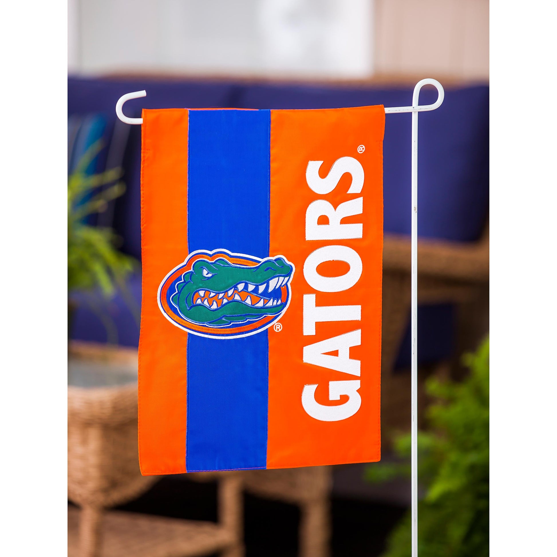 University of Florida Garden Flag orange blue applique with alligator logo Evergreen on white stand on Tampa Home & Garden Store
