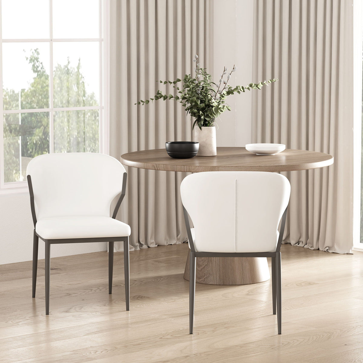 Kirsten Dining Chair Set of 2 white seats with gray metal legs around a wood dining table on Tampa Home & Garden Store