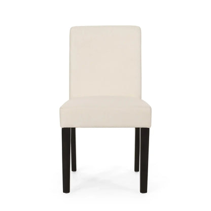 Contemporary dining chair with cream upholstered seating and tapered dark wood legs on Tampa Home & Garden Store