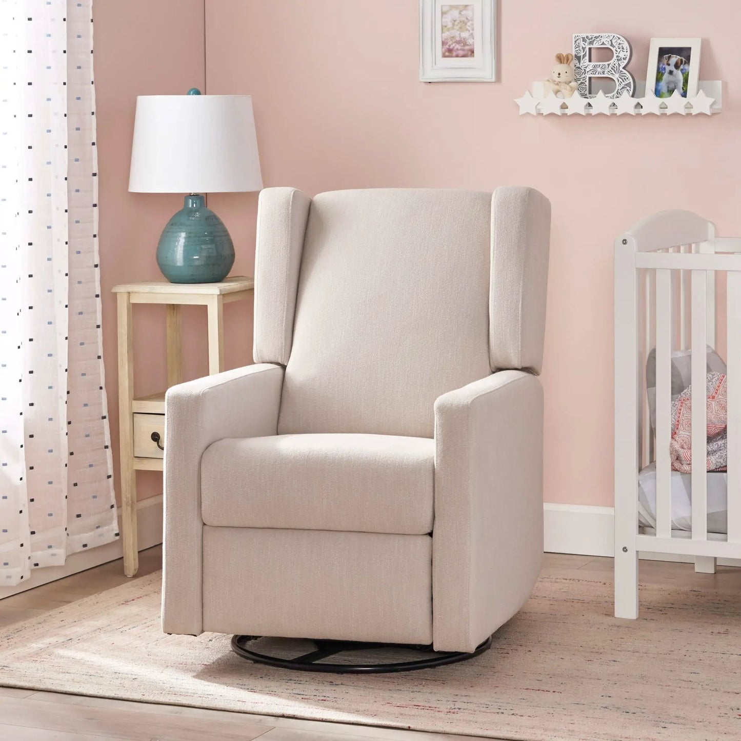 Landau Contemporary Fabric Upholstered Swivel Recliner beige fabric with swivel base in pastel nursery on Tampa Home & Garden Store