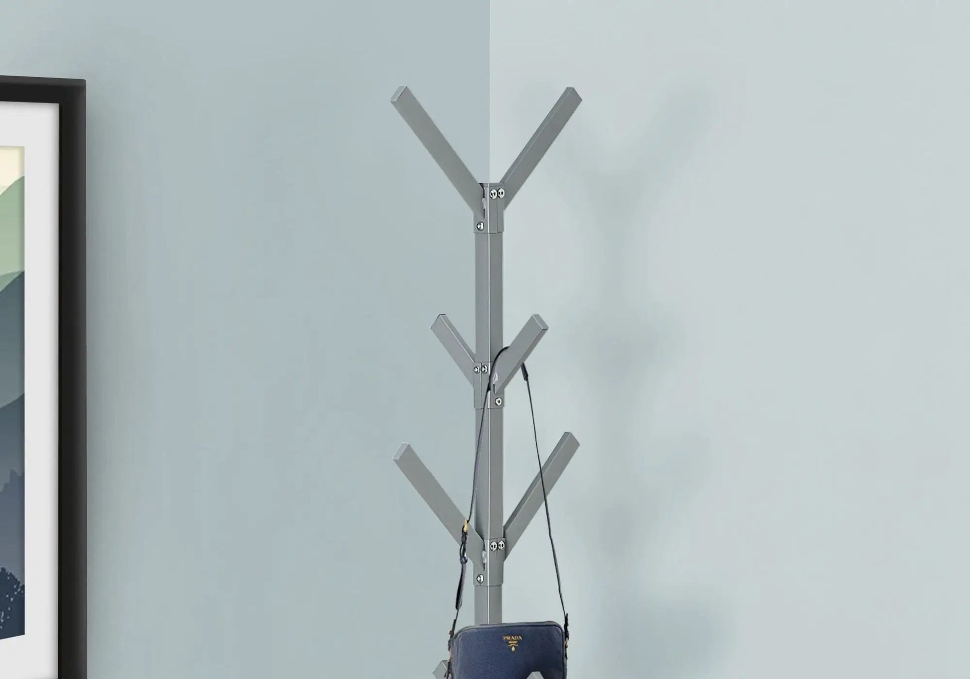 Freestanding coat rack with 8 gray angled hooks, modern hall tree, Prada bag hanging on Tampa Home & Garden Store