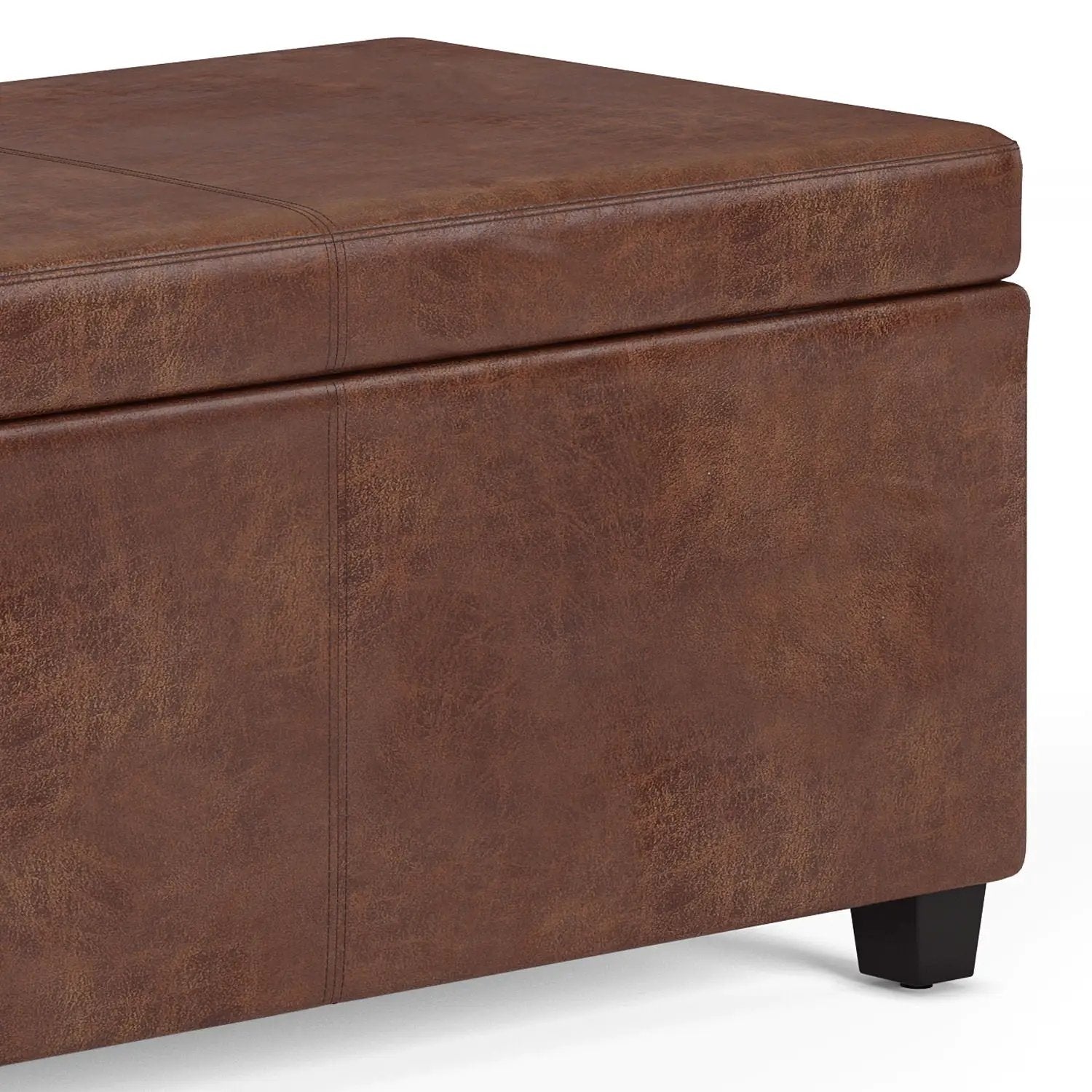 Avalon Storage Ottoman Bench in distressed brown faux leather with stitched seams on black legs on Tampa Home & Garden Store