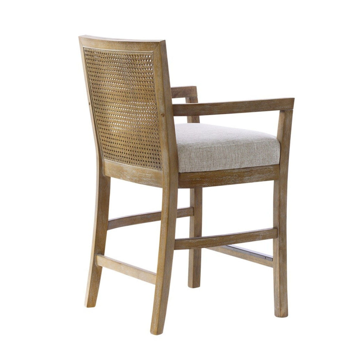 Cane-back counter stool with cream upholstered seat and natural wood frame on Tampa Home & Garden Store